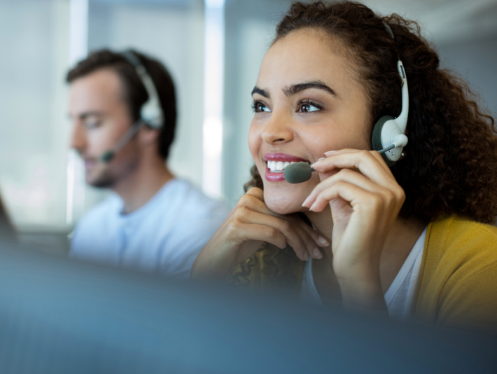 IT Support talking to a customer via headset